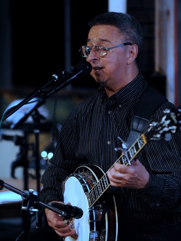 Ernie Martinez playing banjo
                                    with Loose Cannon Bluegrass
